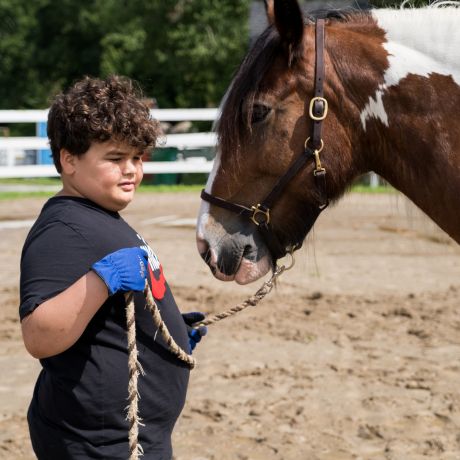 Through respite therapy, Luis found meaningful connection with horses like spotted Gypsy Vanner Noah.